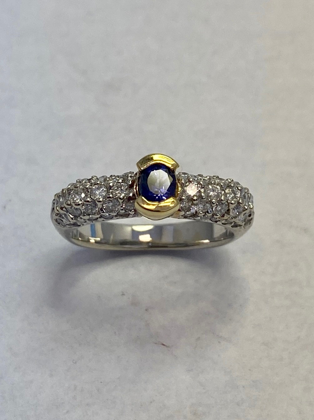 Oval-Cut Yellow Gold Tanzanite ring accented with a diamond