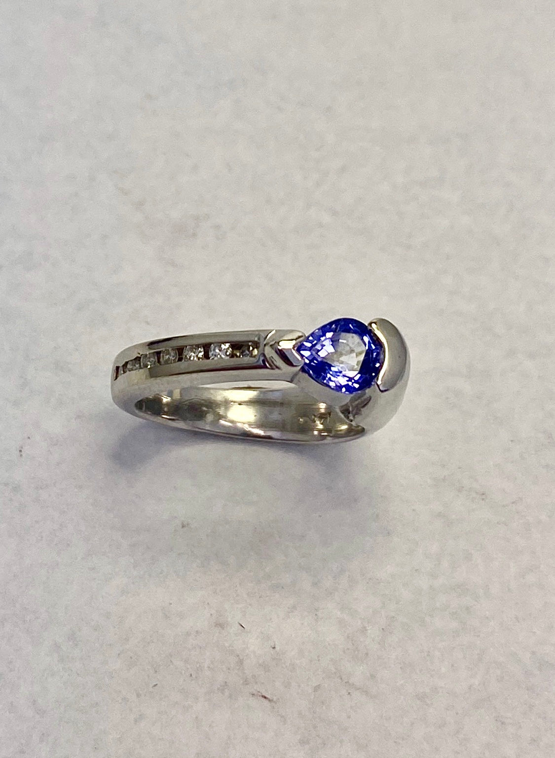 Pear-Shape White Gold Tanzanite ring accented with round full-cut diamonds
