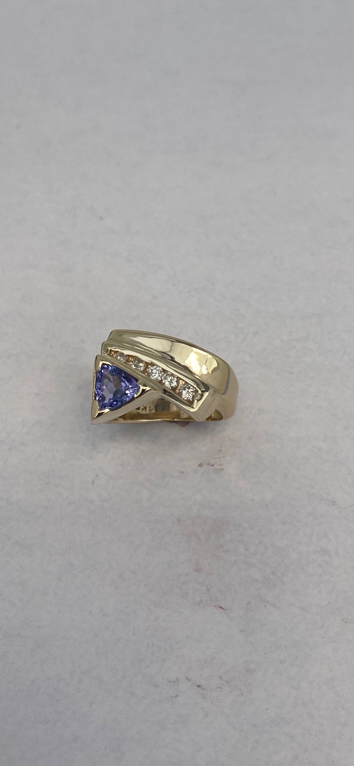 Trilliant-Cut Yellow Gold Tanzanite ring accented with Diamonds