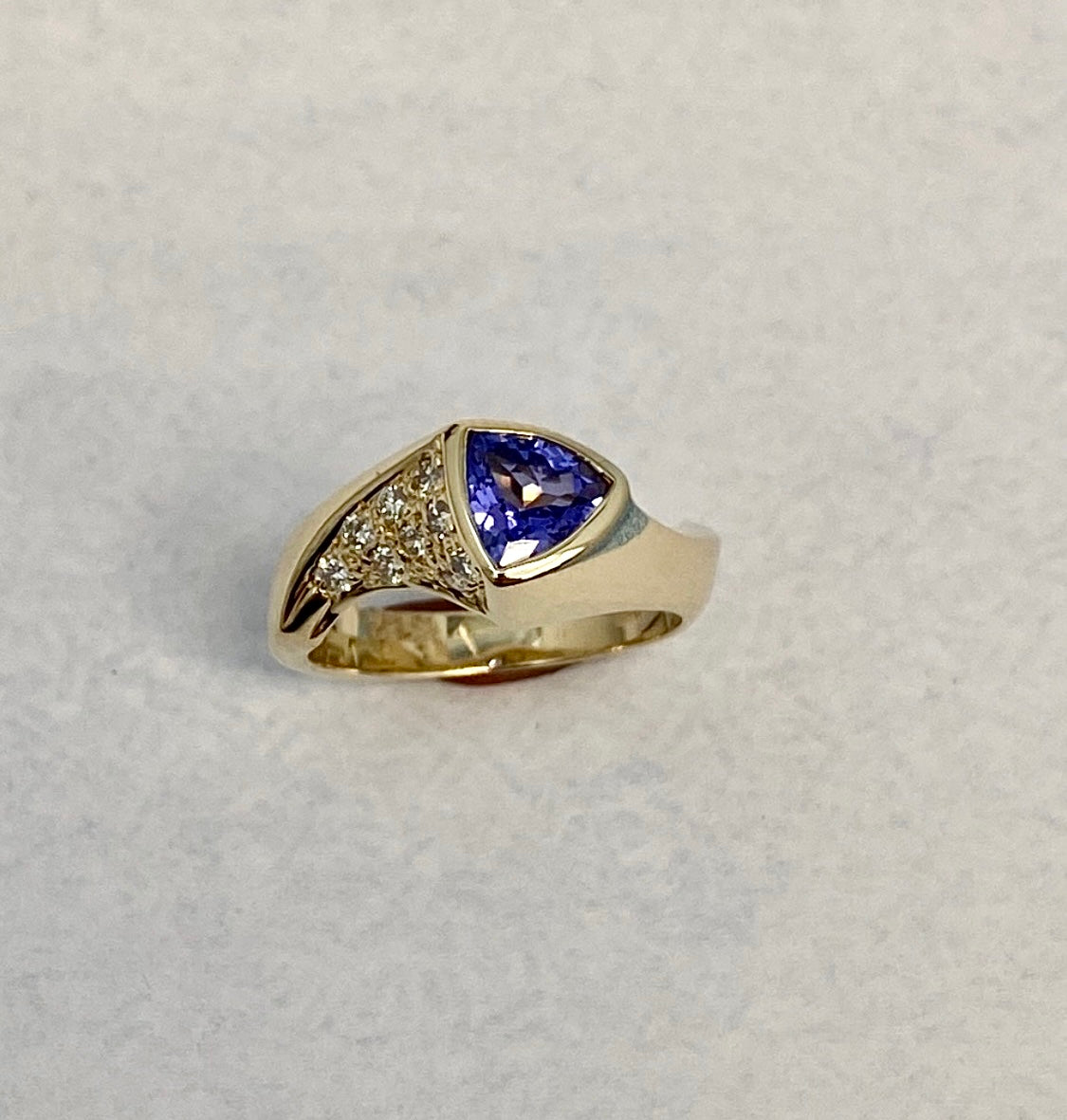 Trilliant-Cut Yellow Gold Tanzanite ring accented with Full-Cut Round Diamonds