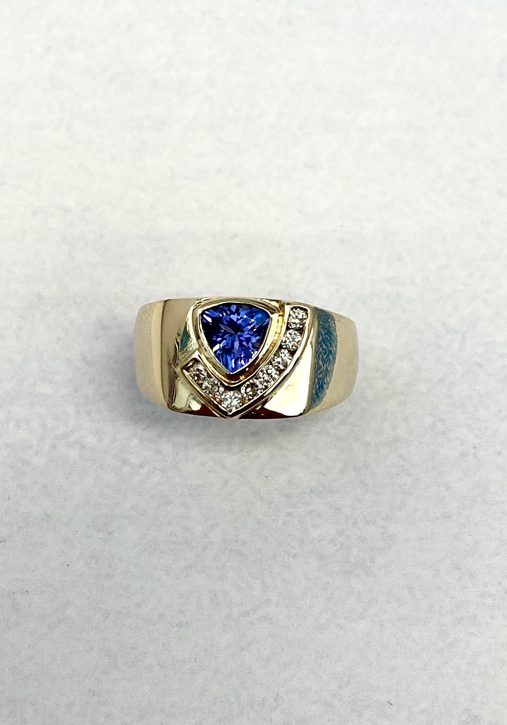 Trilliant-Cut Yellow Gold Tanzanite ring accented with Full-Cut Round Diamonds